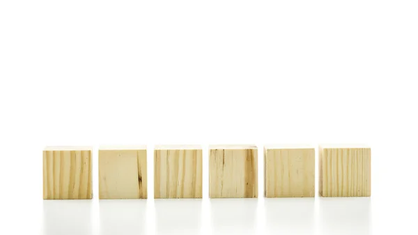 Row of six blank wooden blocks — Stock Photo, Image