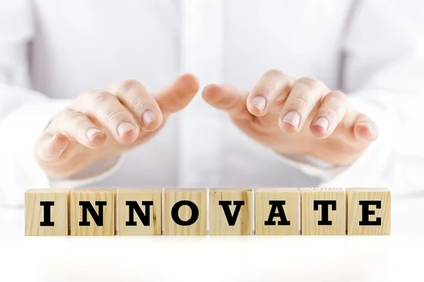 The word - Innovate - on wooden blocks — Stock Photo, Image