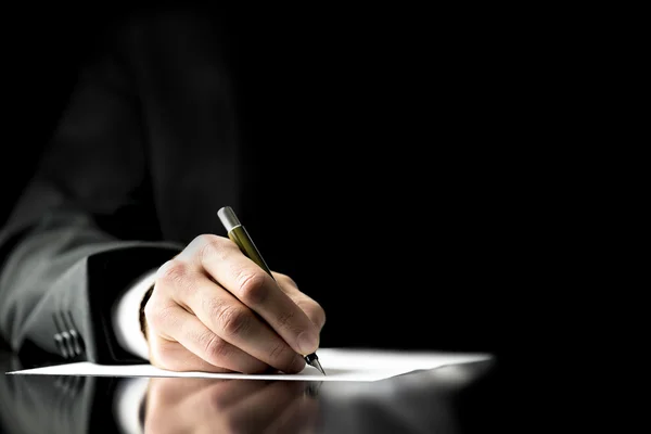 Businessman signing a document — Stock Photo, Image