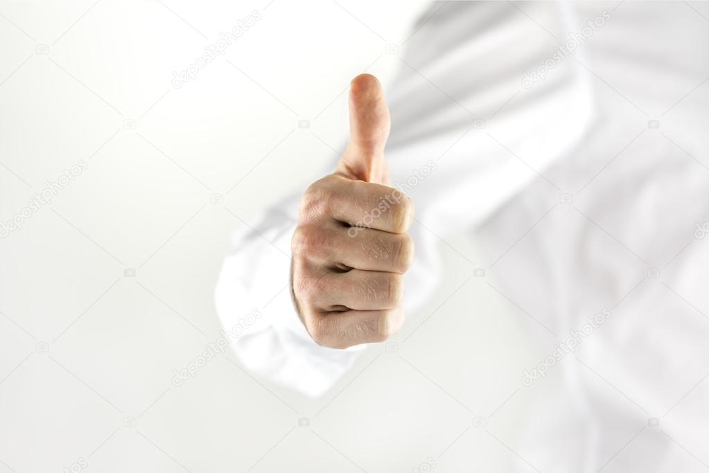 Motivated man giving a thumbs up sign