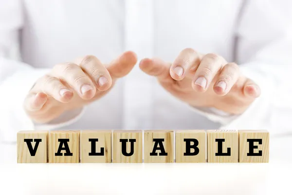 The word - Valuable- on wooden cubes — Stock Photo, Image