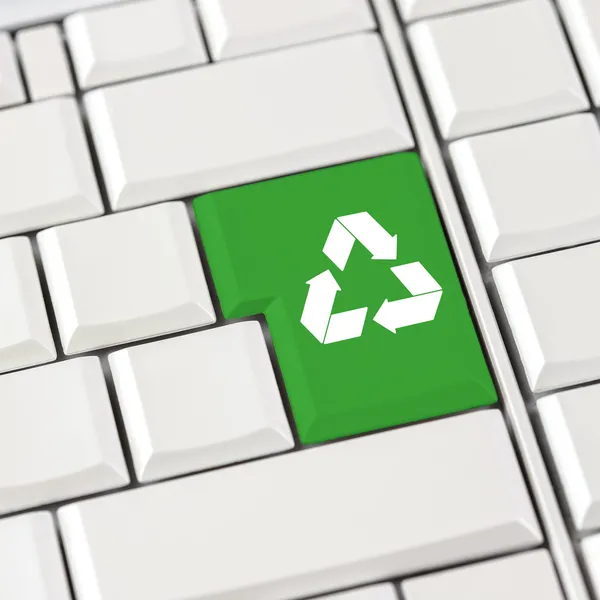 Green recycle icon on a computer keyboard — Stock Photo, Image