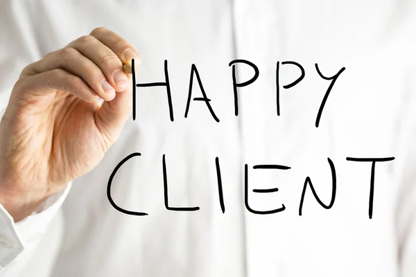 Uomo che scrive Happy Client su uno schermo virtuale — Foto Stock