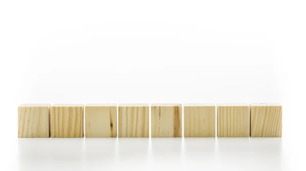 Row of eight blank wooden blocks — Stock Photo, Image