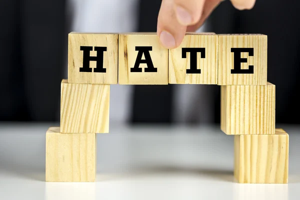 Bridge of cubes with word hate written on them — Stock Photo, Image