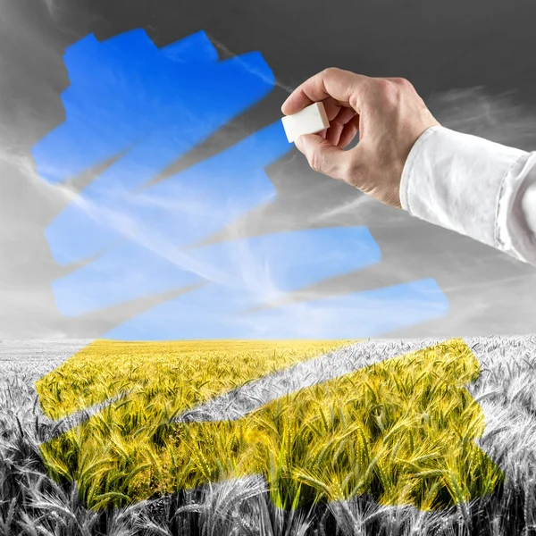 Man erasing air pollution to reverse damage — Stock Photo, Image