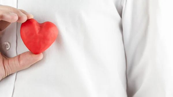 Man holding a red heart — Stock Photo, Image