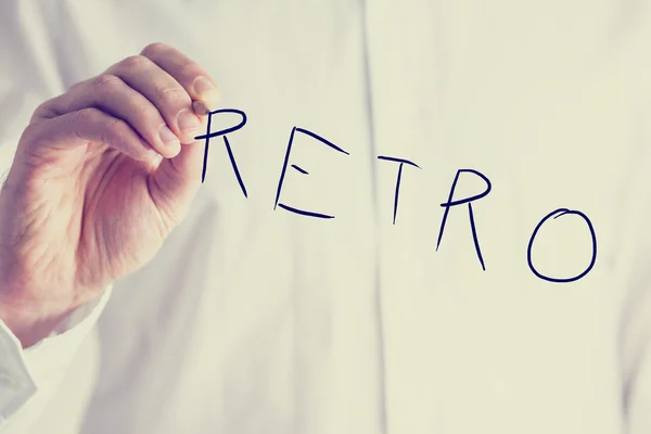 Man writing the word Retro on a virtual screen — Stock Photo, Image