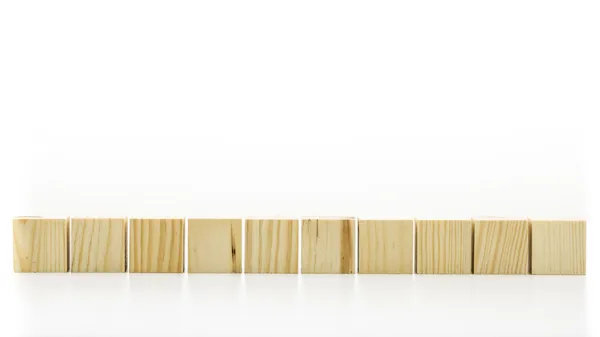 Row of ten blank wooden blocks — Stock Photo, Image