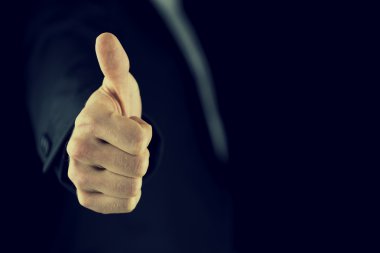 Thumbs up gesture of approval and success clipart
