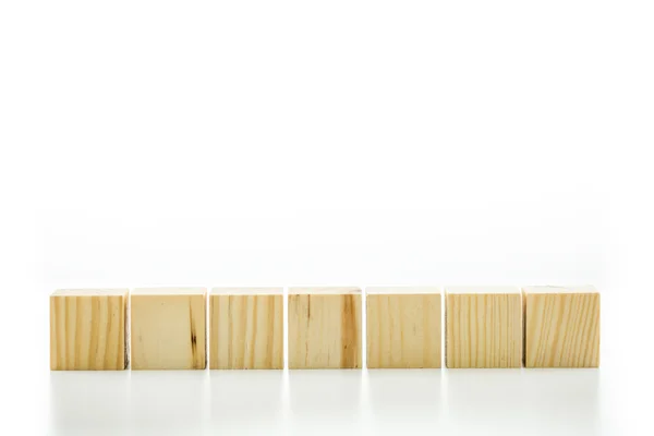 Seven blank wooden blocks — Stock Photo, Image