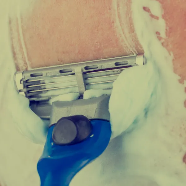 Man shaving using shaving cream or foam — Stock Photo, Image