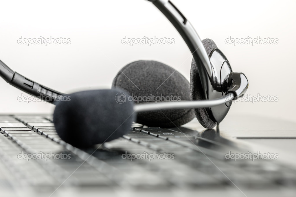 Headset lying on a laptop computer