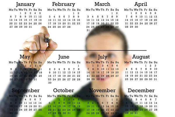 Virtual calendar with a woman writing in copyspace — Stock Photo, Image