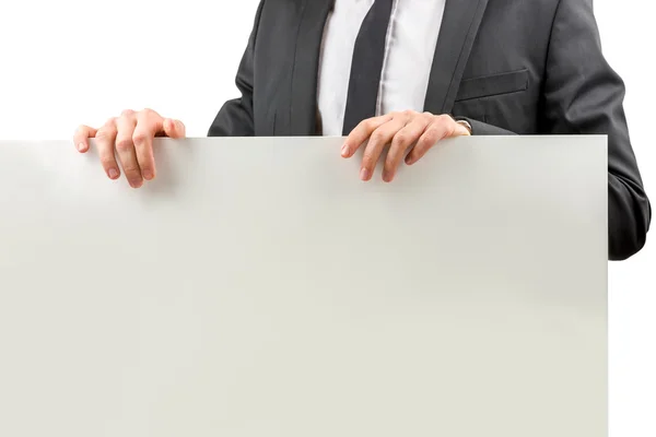 Businessman holding a blank sign — Stock Photo, Image