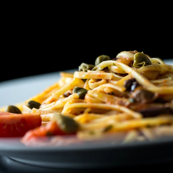 Plate of cooked savory Italian spaghetti — Stock Photo, Image