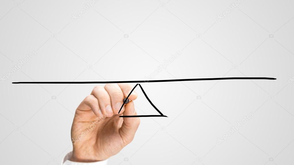 Man drawing a seesaw