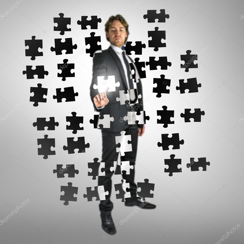 Businessman Selecting A Puzzle Piece Stock Photo Image By C Gajus Images 44439069