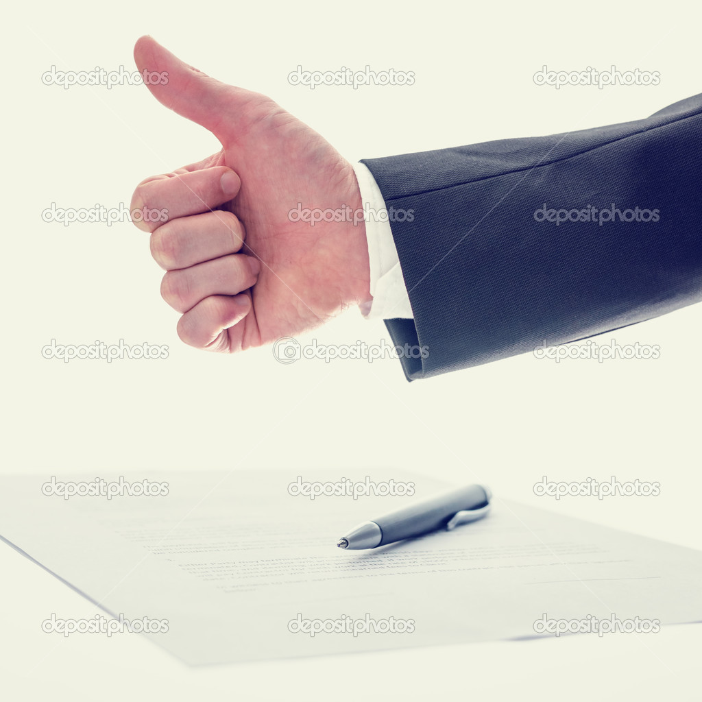 Businessman giving a thumbs up gesture