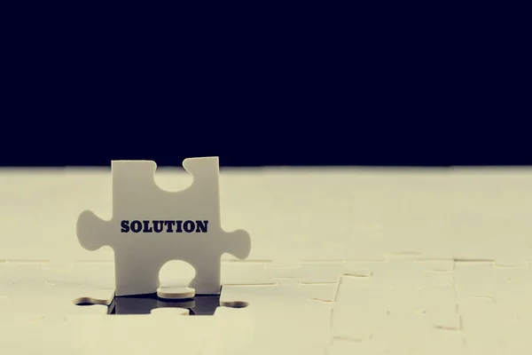 Last puzzle piece with the word - Solution — Stock Photo, Image