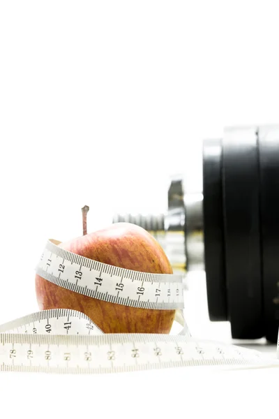 Apple wrapped around with measuring tape — Stock Photo, Image