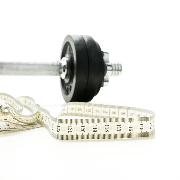 Svinovací metr a tělocvična váha — Stock fotografie