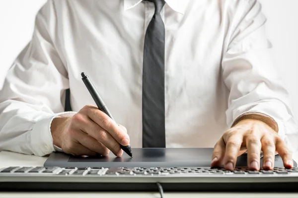 Skilled male designer drawing on a graphics tablet — Stock Photo, Image