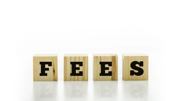 The word - Fees - on wooden blocks or cubes — Stock Photo, Image