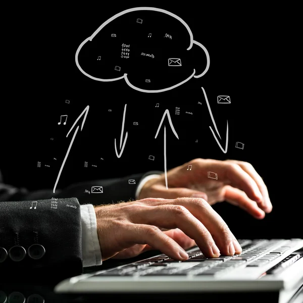Businessman synchronizing files with the cloud — Stock Photo, Image
