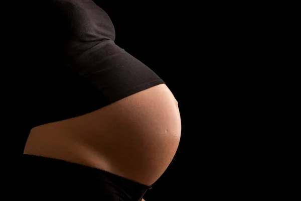 Blootgestelde zwangere buik — Stockfoto