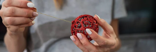 Closeup View Female Hand Attaching Golden String Shiny Red Christmas — Stock Photo, Image