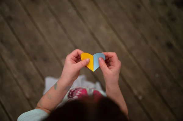 Top View Child Holding Heart Shaped Paper Colors Ukrainian Flag — Stock Photo, Image