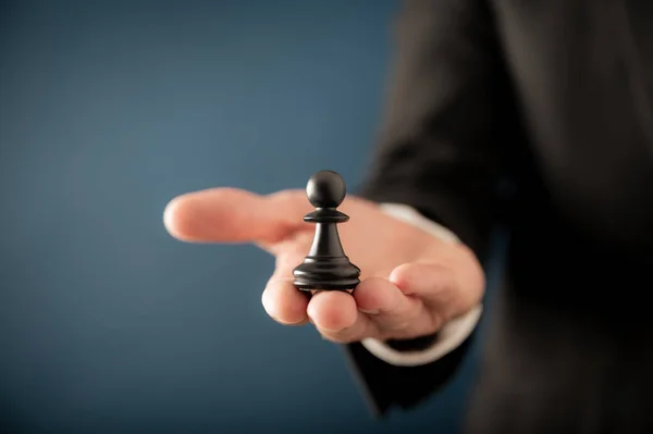 Hand Businessman Presenting Black Pawn Chess Figure Conceptual Image Business — Stok fotoğraf
