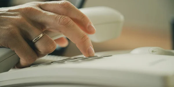 Low Angle Closeup View Caucasian Female Hand Holding Telephone Receiver — 图库照片