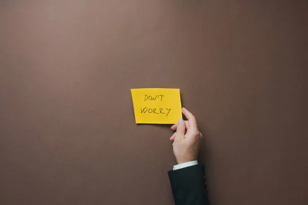 Top View Hand Businessman Placing Yellow Paper Dont Worry Sign — Foto de Stock