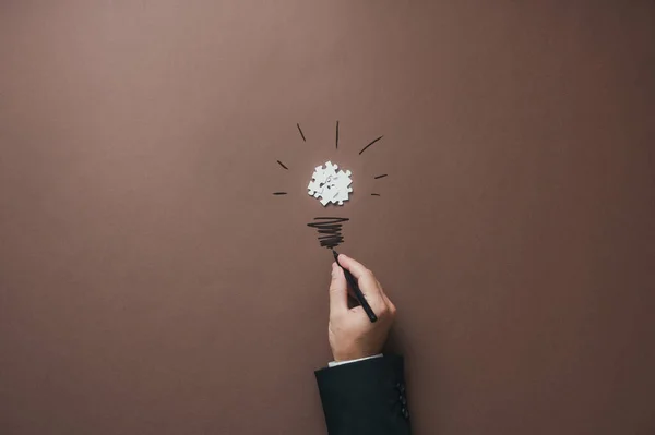 Hand Businessman Drawing Lightbulb Stem Bulb Made Puzzle Pieces Conceptual — Photo