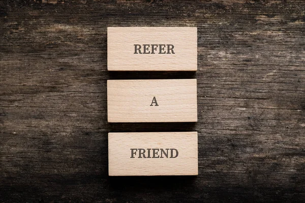 Refer Friend Sign Written Three Stacked Wooden Pegs Rustic Wooden — 图库照片