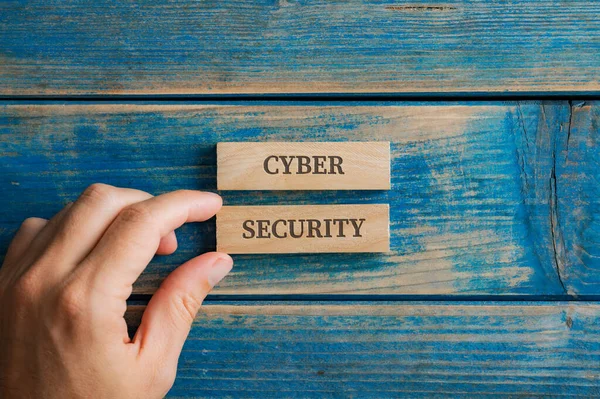 Male Hand Assembling Cyber Security Sign Written Two Wooden Pegs — Stock Photo, Image