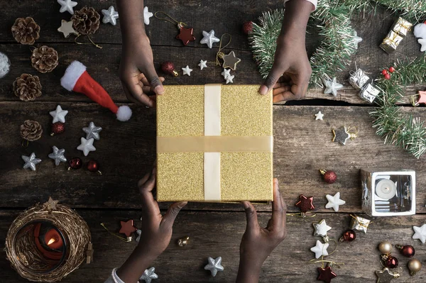 Two Black Coloured Girls Holding Shiny Golden Gift Box Placed — Stock Photo, Image