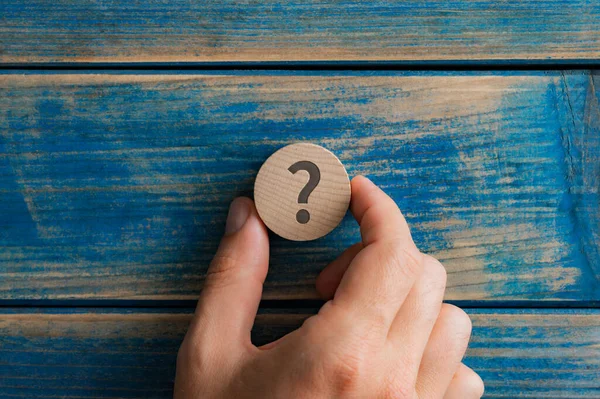 Male Hand Placing Wooden Cut Circle Question Mark Aged Blue — Stock Photo, Image