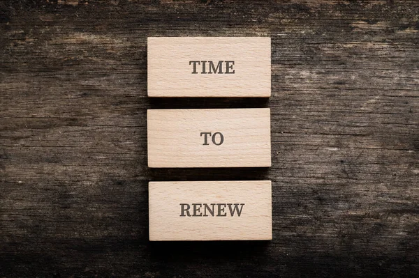 Time Renew Sign Spelled Three Stacked Wooden Blocks Placed Rustic — Stock Photo, Image