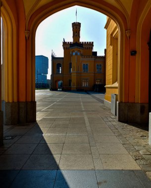 Wroclaw, Poland - July 4 2021: Facade of main railway station framed in building arc at morning after sunrise