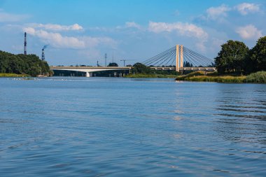 Wroclaw, Poland - July 15 2021: Odra river with big millennium bridge over it at sunny day 