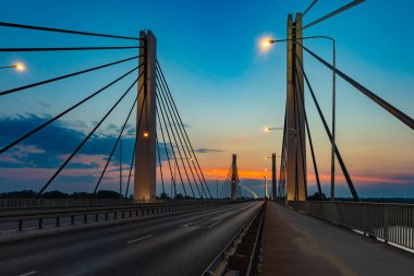 Wroclaw, Poland - July 25 2021: Beautiful morning sunrise seen over millennium bridge