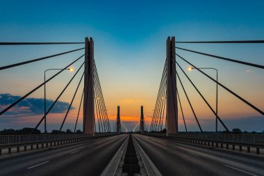 Wroclaw, Poland - July 25 2021: Beautiful morning sunrise seen over millennium bridge