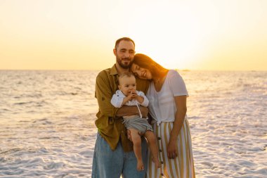 Happy family having fun playing beach in summer vacation on the beach.