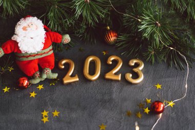 Happy New Years 2023. Christmas background with cone tree and Christmas decorations. Christmas holiday celebration. New Year concept.