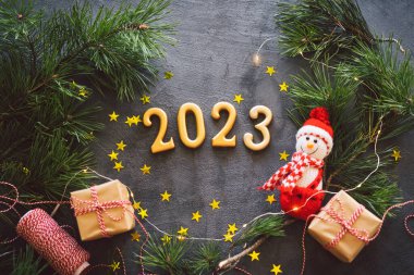 Happy New Years 2023. Christmas background with cone tree and Christmas decorations. Christmas holiday celebration. New Year concept.