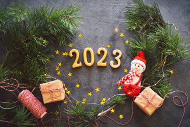 Happy New Years 2023. Christmas background with cone tree and Christmas decorations. Christmas holiday celebration. New Year concept.