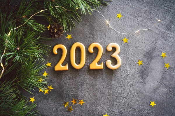 Happy New Years 2023. Christmas background with cone tree and Christmas decorations. Christmas holiday celebration. New Year concept.